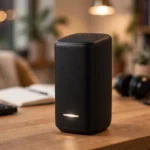 Xfinity xFi gateway with a blinking white light on a desk